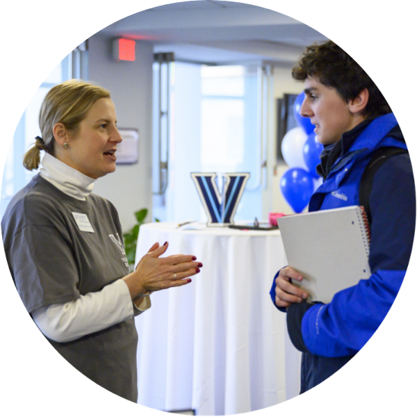 Michele Gianforcaro speaking with a male student