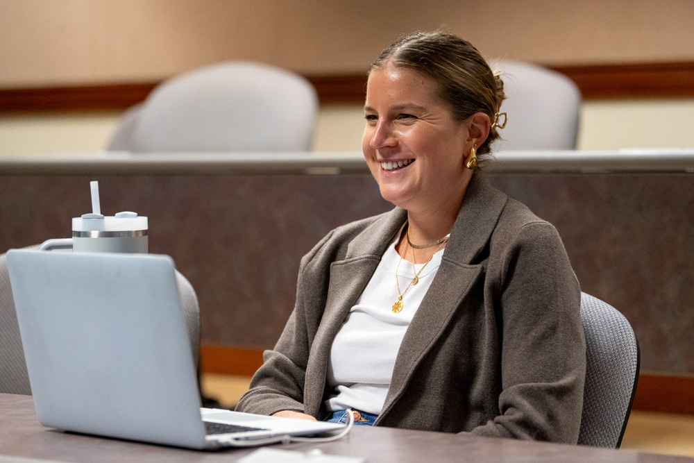 Three students talking in cafe