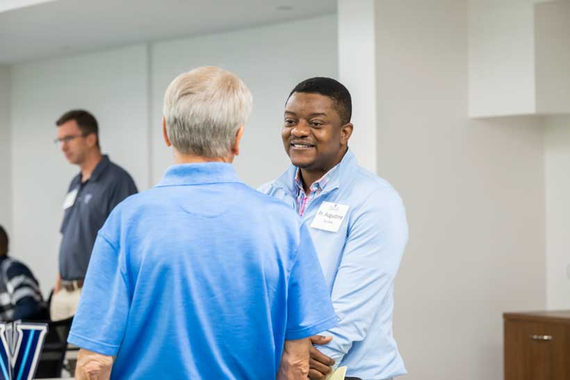 Two people speaking to each other