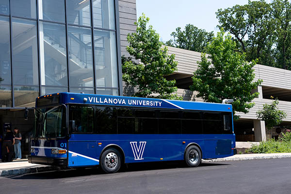 A Villanova shuttle with a building behind it