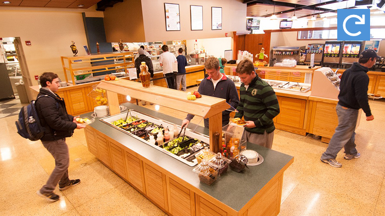 Students are getting their food in the self-served style cafeteria.