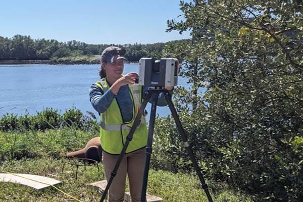 Sarah Burghardt doing research by a swamp