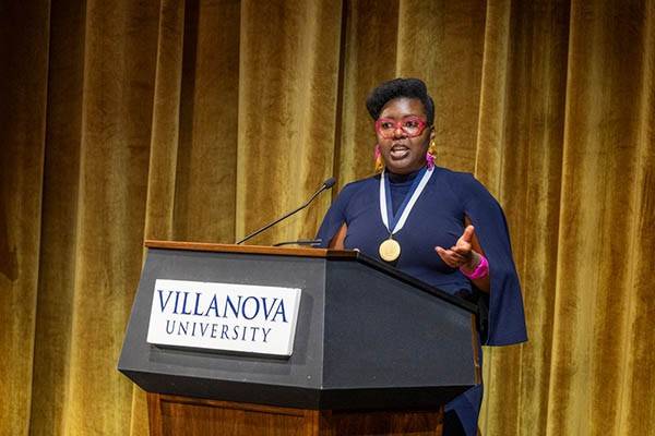Britney Davis at a podium giving a speech