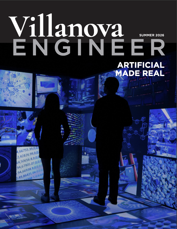 Magazine cover featuring two students starting at screens in the CAVE