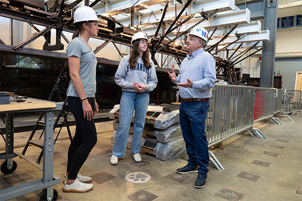 David Dinehart and two students in the Structures Lab