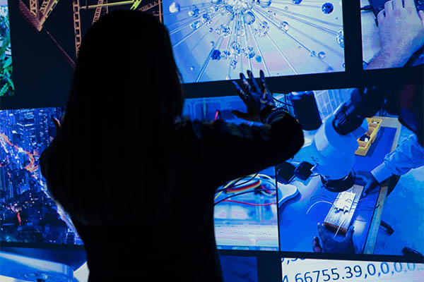 A woman moving screens with her hands