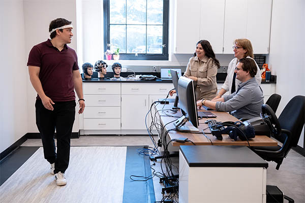 Students and a professor in the Brain Lab