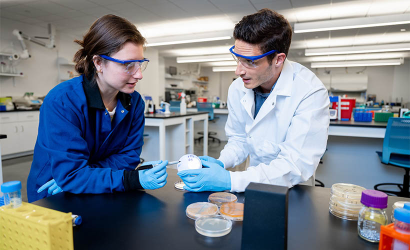 student and professor in a chemical engineering lab