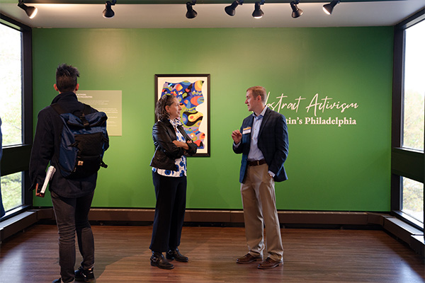 People talking in an art gallery