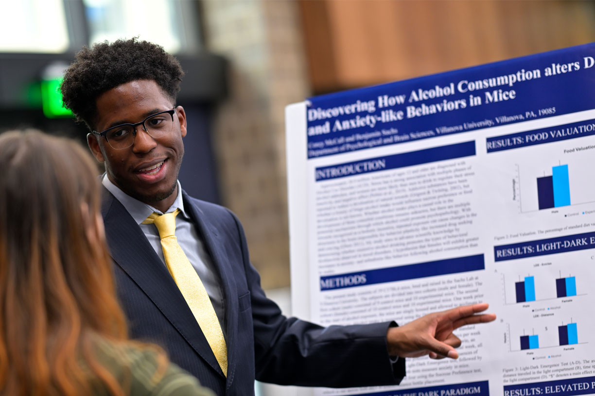 Male student presenting research