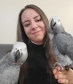 Suzanne Gray holding two birds