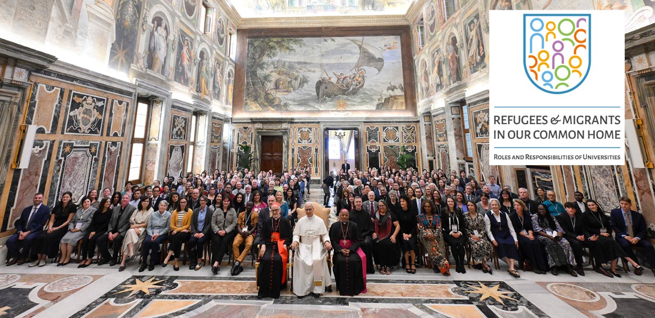 Villanova delegation sitting with Pope Leo in Rome during the Refugees and Migrants in Our Common Home conference. A conference logo is in the top-right corner of the image.