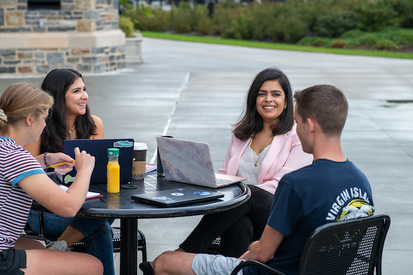 Professor and students sitting