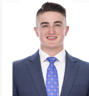 Headshot of a man in a suit against a white background