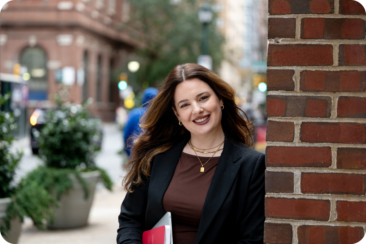 Female student smiling at camera outside