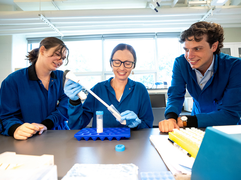 Sarah Fritz, PhD, and two student researchers in the lab