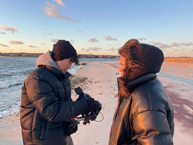Two students filming the social justice documentary, "Seeds We Bury"