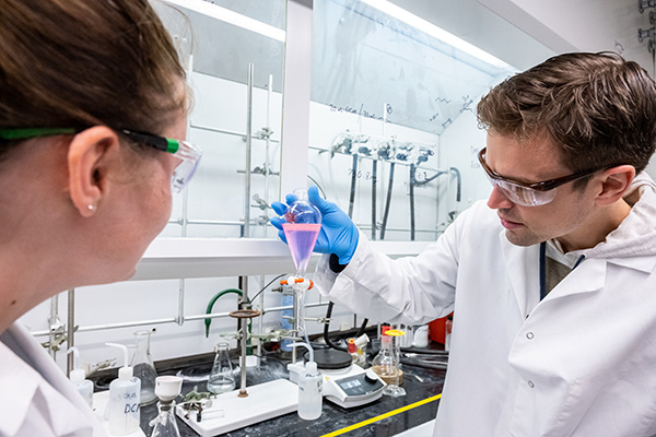 Two students in research lab
