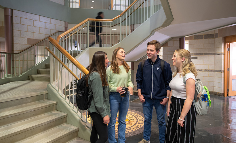 Students talk outside the Ellis Center in the St. Augustine Center.