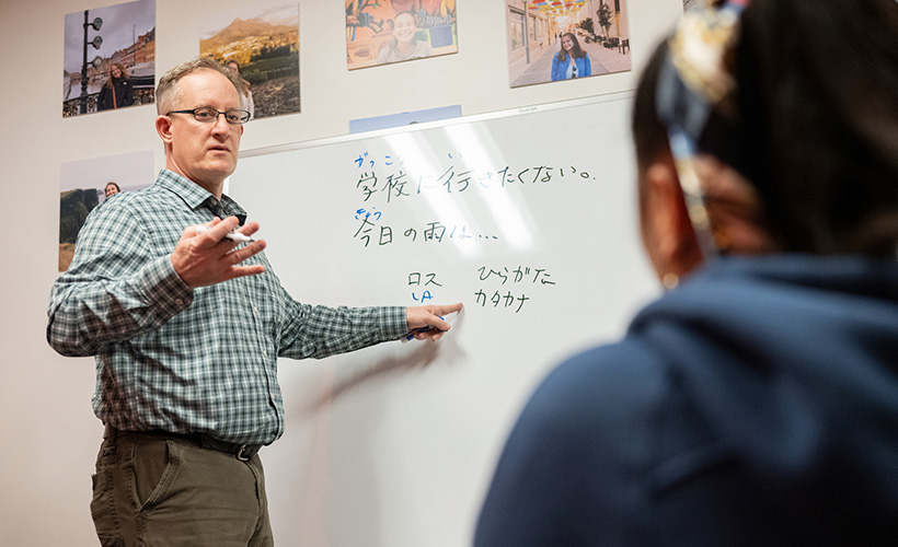 Nathan Badenoch, PhD, associate professor of Japanese and asian studies, teaches at the white board.