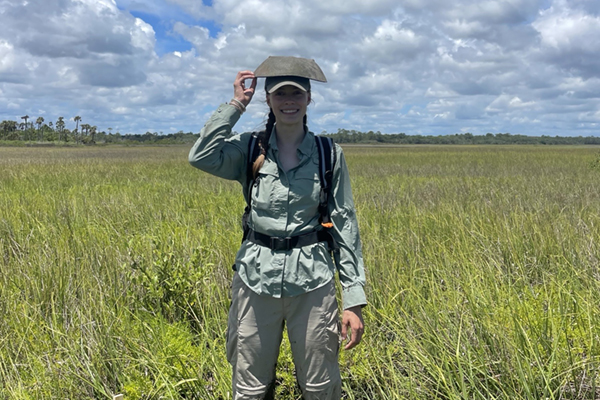 Faith Yost '27 CLAS in a field
