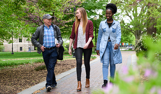 Graduate students walking on campus