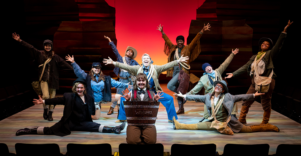 musical theatre performers on stage