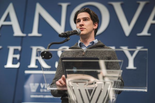 A student presents at the annual Graduate Research Symposium.