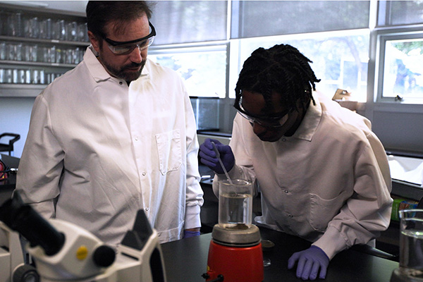 Steven Goldsmith, PhD, and student working in the lab.