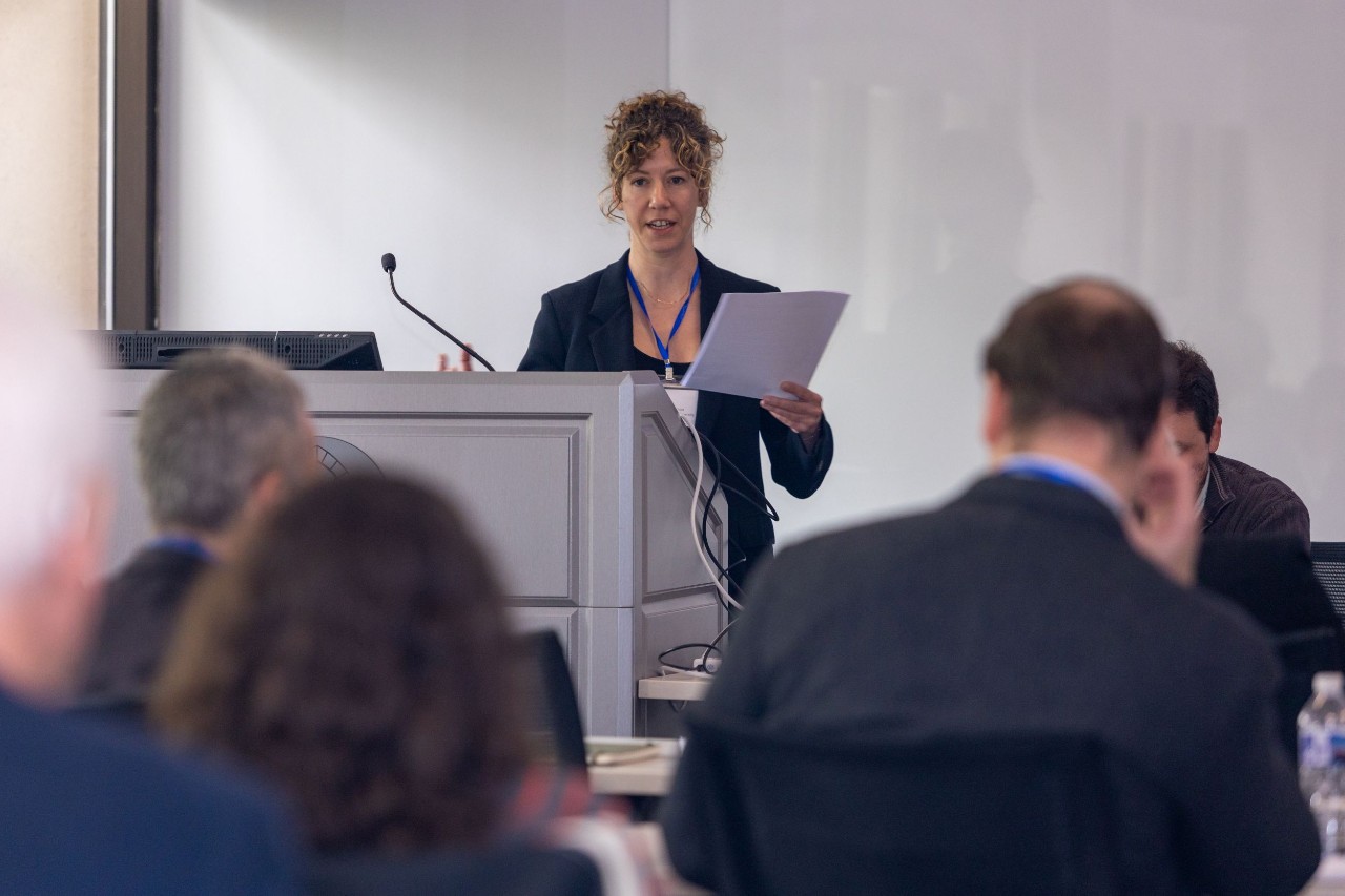 Philosophy student speaking in front of a classroom.