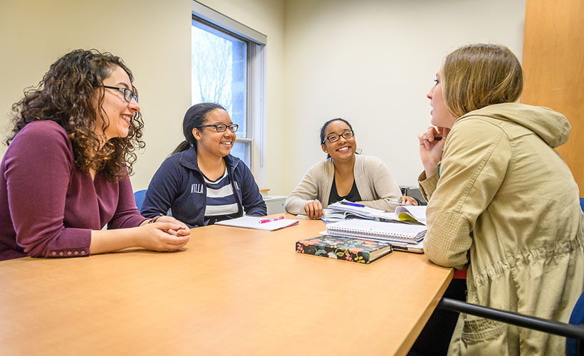 A group of Philosophy students engage in discussion.