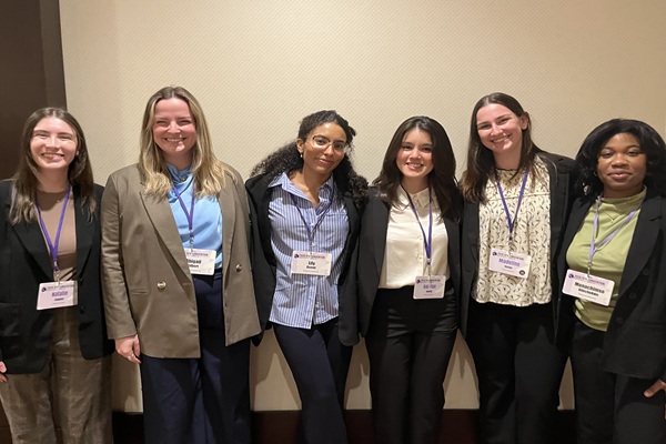 image of students standing together at conference