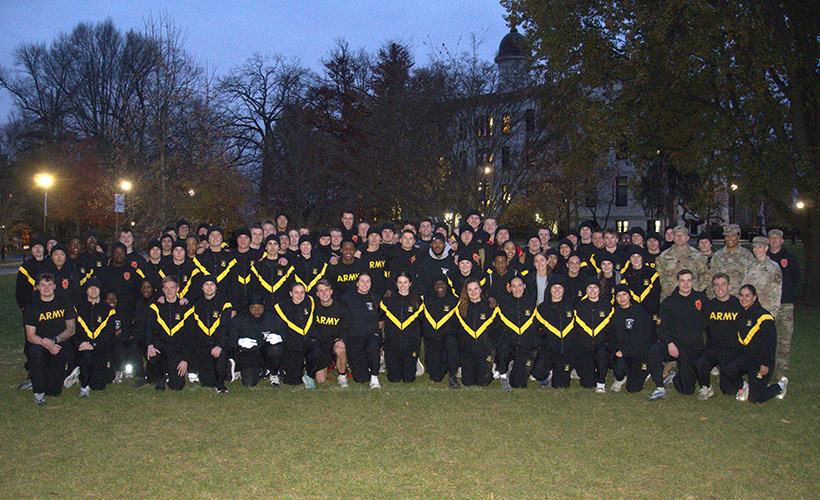 ROTC students posing for a photo in the grass