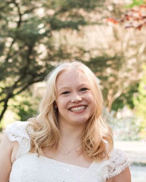 Ellie Holt smiling at camera