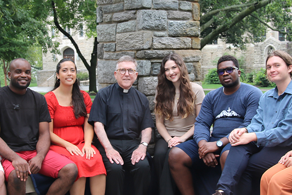 image of students and faculty sitting outside