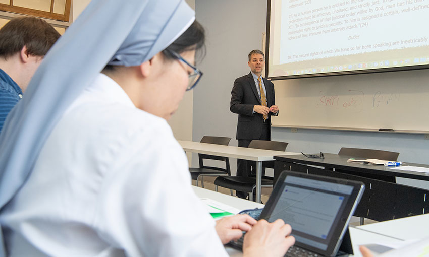 image of students taking notes in class