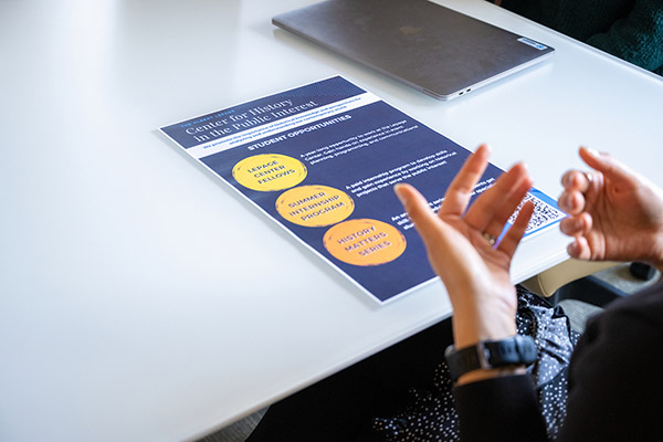 A student looks at a flyer