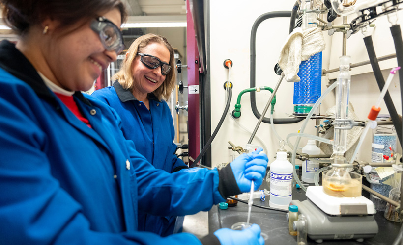 A faculty member and her student work in the lab together.