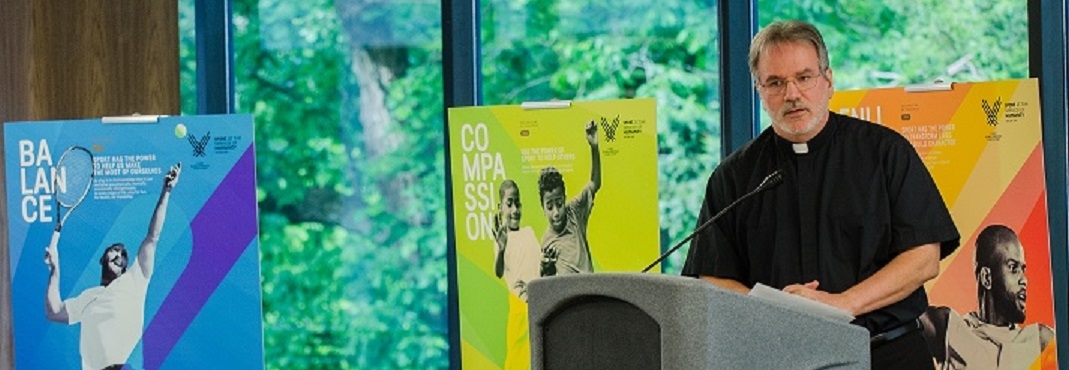 Image of Reverend Patrick Kelly, SJ, speaking at conference