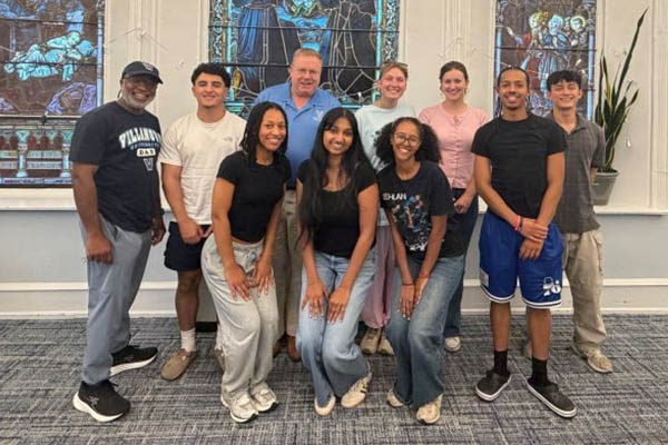 Group of students and staff posing for picture