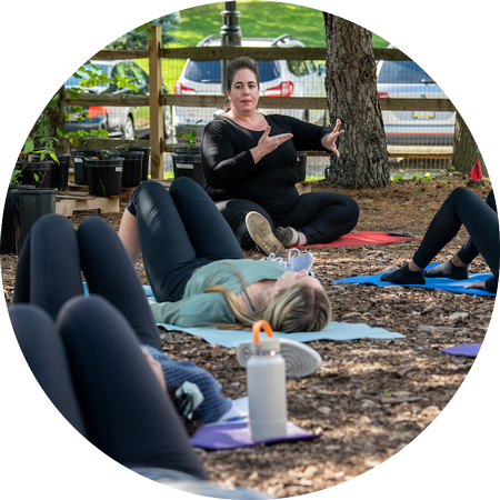 Students doing yoga outside