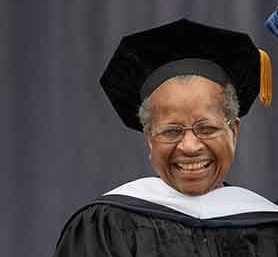Sister Cora Marie Billings smiles at a graduation ceremony.