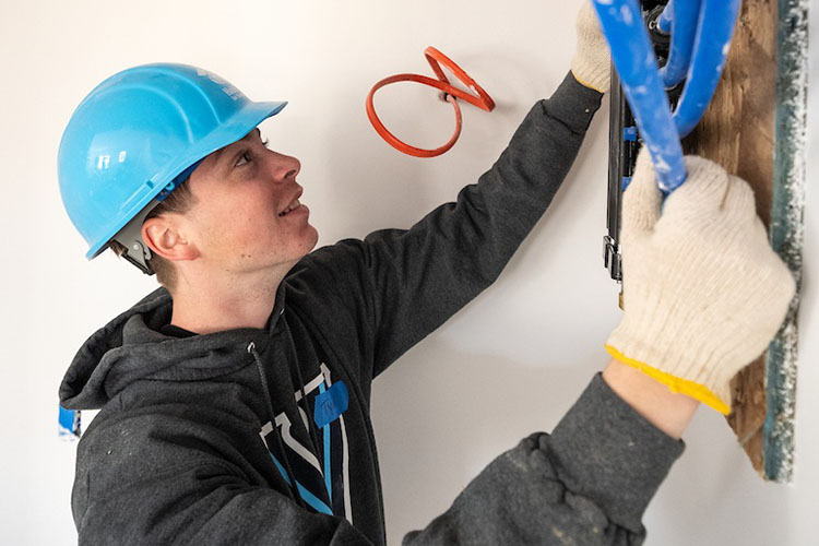 A Villanova student helps at Habitat for Humanity.