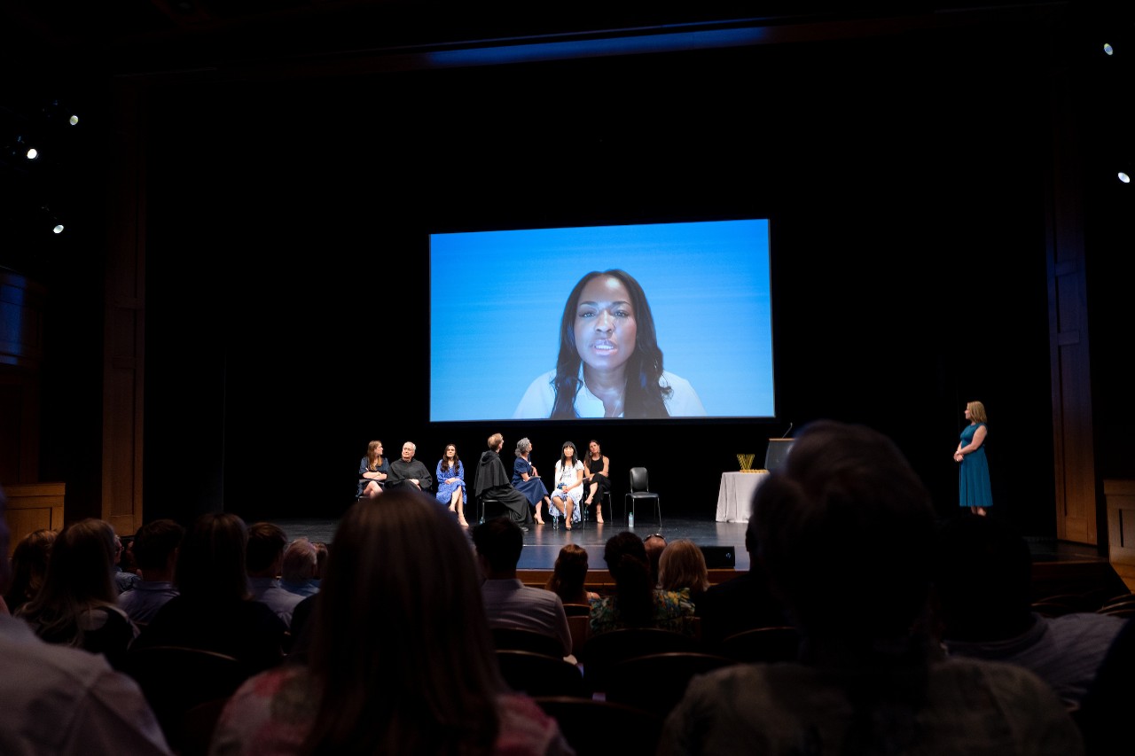 Ebony Burns speaking on screen