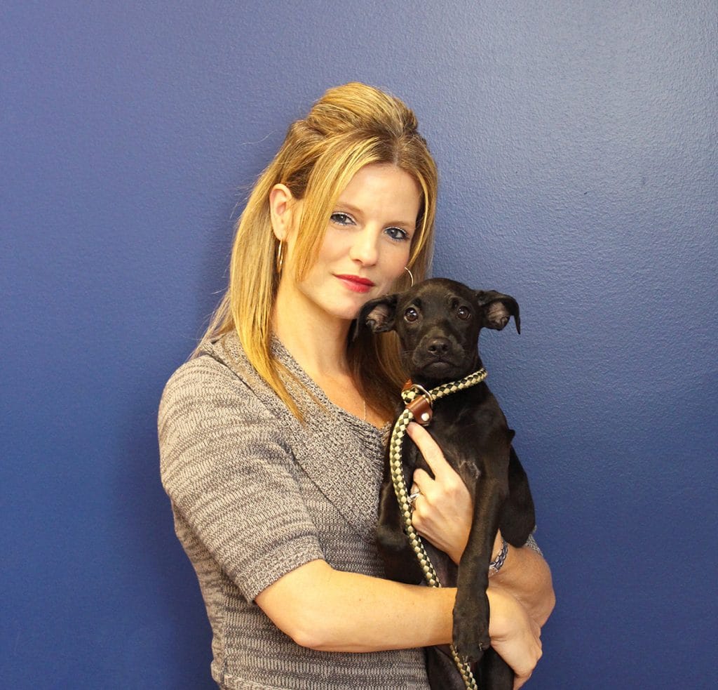Jen Villalobos with a puppy