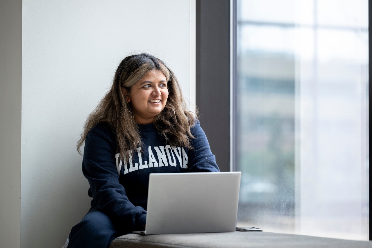 Student works on laptop computer