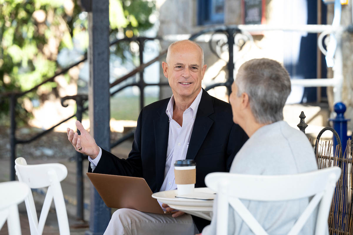 Two older students talking