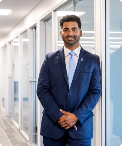 man in tie smiling at the camera