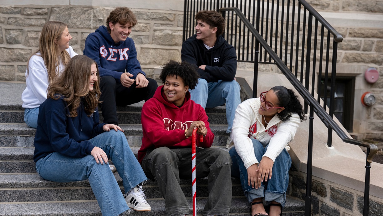 Fraternity and Sorority Life students sitting on Corr Hall steps