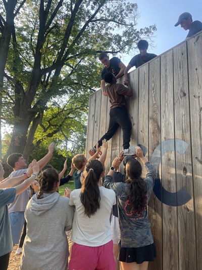 Students work together to complete the Villanova Challenge Course
